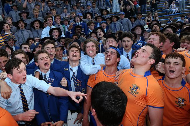Nick Baker (second from the right) and Ashgrove teammates celebrate an AIC rugby premiership in 2019.