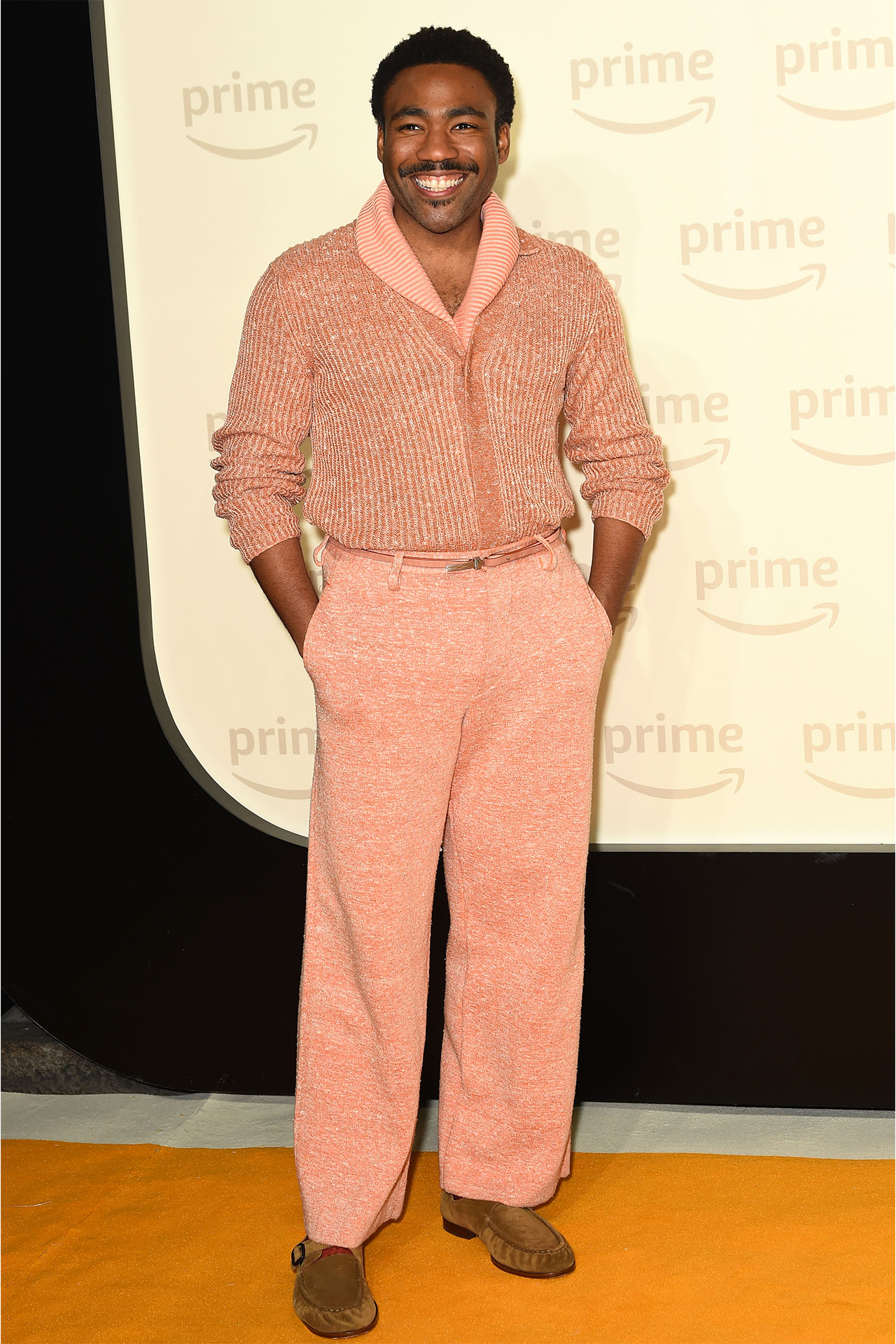 <p><em>Donald Glover</em></p><p>&nbsp;</p><p>There is a middle ground between Elordi and Youssef's more low-key silhouettes and Bieber's huge Marni number. Donald Glover walks that line well with a thicker, Zegna number in Pantone&rsquo;s Colour of the Year, Peach Fuzz. He also takes it one step further by matching the peach and knit texture on his bottom half. The result is playful yet still with a mature edge.&nbsp;</p>