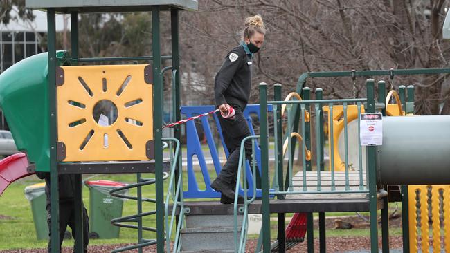 Parks staff close down a children's playground in Melbourne’s Albert Park during the state’s sixth lockdown. Picture: NCA NewsWire / David Crosling