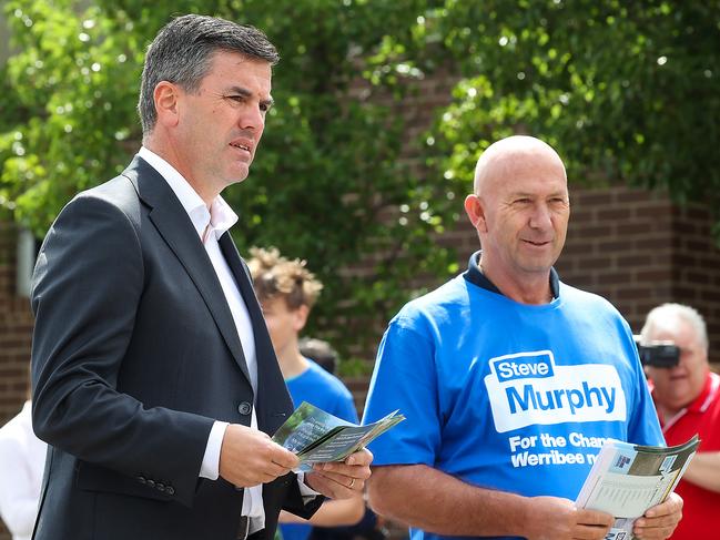 Opposition Leader Brad Battin hands out how-to-vote flyers at the polling booth at Manor Lakes P-12 College. Picture: Ian Currie