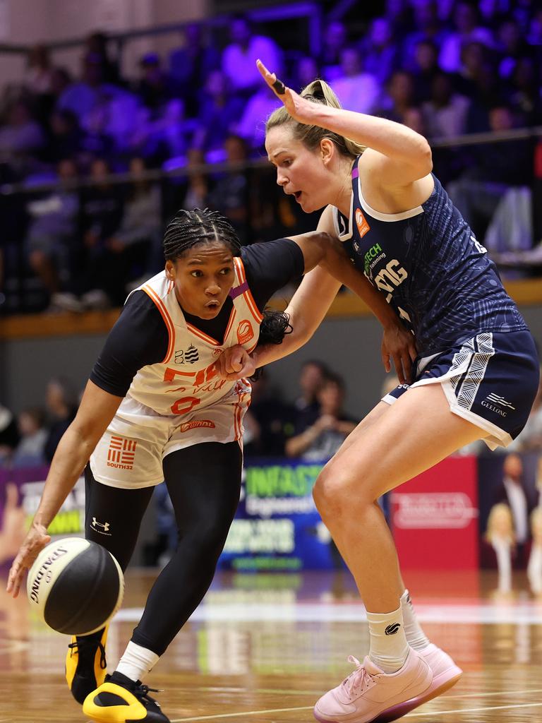 GEELONG, AUSTRALIA - OCTOBER 30: Zia Cooke of the Townsville Fire dribbles the ball against Keely Froling of Geelong United during the round one WNBL match between Geelong United and Townsville Fire at The Geelong Arena, on October 30, 2024, in Geelong, Australia. (Photo by Kelly Defina/Getty Images)