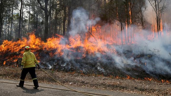 A fire near houses at Telegraph Point on the NSW mid north coast. Picture: Nathan Edwards