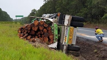 Logging truck rollover near Wallu