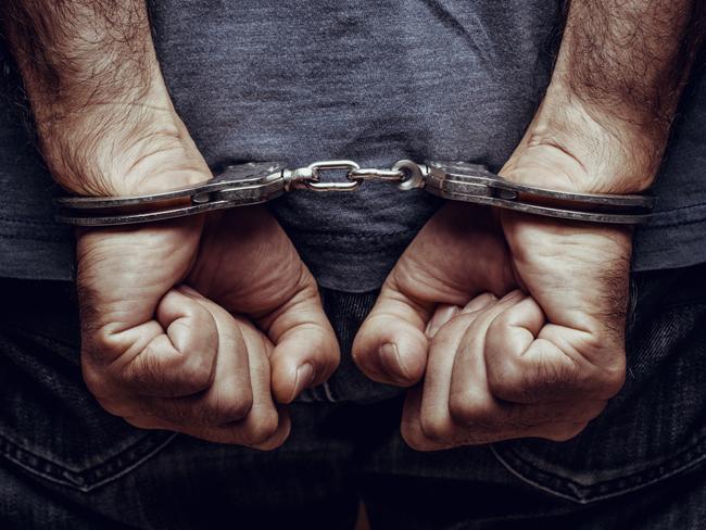 Arrested man in handcuffs. Photo: iStock