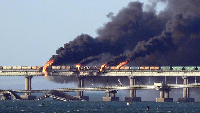 Black smoke billows from a fire on the Kerch bridge that links Crimea to Russia, after a truck bomb exploded. Picture: AFP