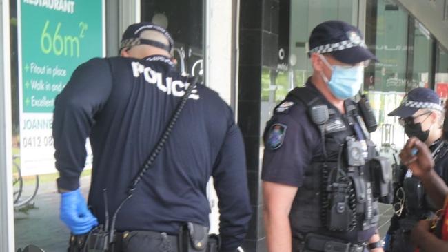 Police at work in Shields St in the centre of Cairns. Picture: Peter Carruthers