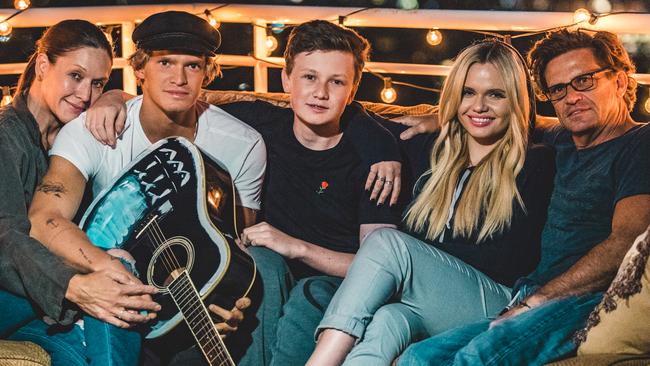 Alli Simpson, seen here with mum Angie, brothers Cody and Tom, and dad Brad, credits her tight-knit family for helping deal with online trolling. Picture: Supplied