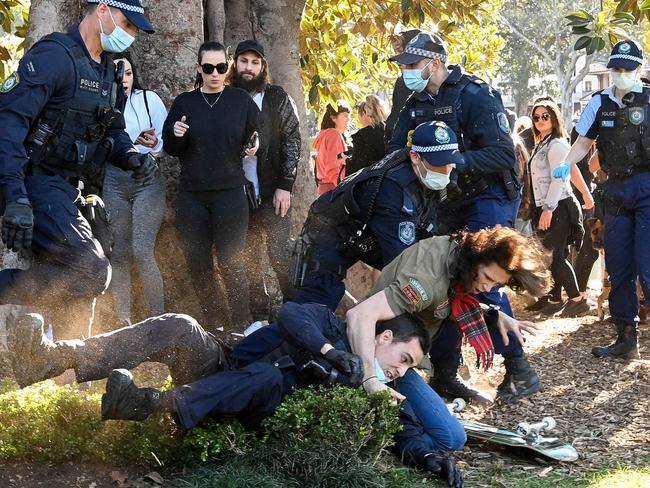 A police officer on the ground during the protests in Sydney. Picture: NCA NewsWire/Bianca De Marchi