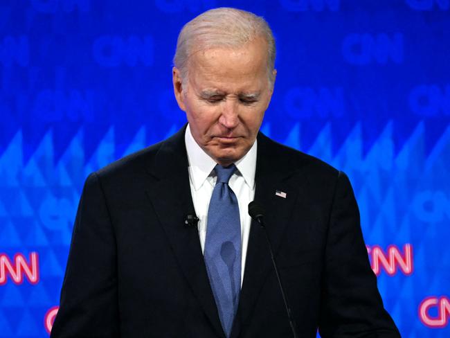 TOPSHOT - US President Joe Biden looks down as he participates in the first presidential debate of the 2024 elections with former US President and Republican presidential candidate Donald Trump at CNN's studios in Atlanta, Georgia, on June 27, 2024. (Photo by ANDREW CABALLERO-REYNOLDS / AFP)