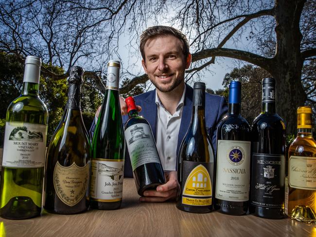 Beverage Director Marcell Kustos with bottles of wine that are part of the Restaurant Botanic's $800 wine pairing, pictured on August 1st, 2022, at the Adelaide Botanic Gardens.Picture: Tom Huntley