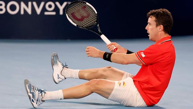 Roberto Bautista Agut finds himself on his backside after an attempt to hit a return.