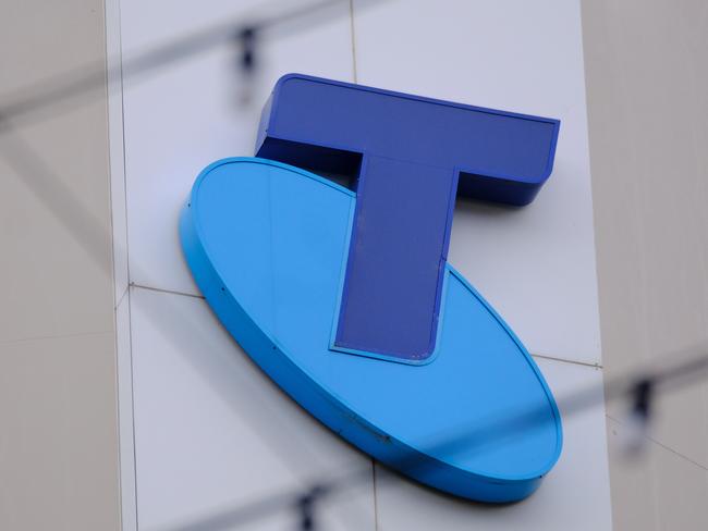 MELBOURNE, AUSTRALIA - NewsWire Photos OCTOBER 4, 2022. Generic photo people walking past the Telstra logo in Melbourne..Picture: NCA NewsWire / Luis Enrique Ascui