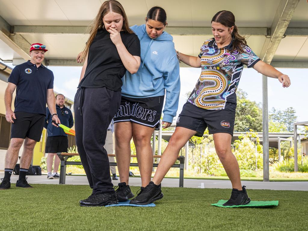 Project Booyah youth program participants (from left) Hanna, Kadisha and Holly work on a team building problem solving exercise in Toowoomba at Denise Kable Youth Services Centre, Tuesday, March 12, 2024. Picture: Kevin Farmer