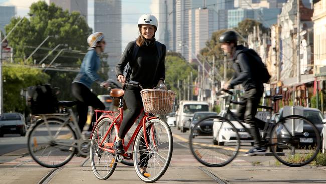 Cassandra Smith cycles to work in Melbourne, making use of a leafy, easily accessible bike trail. ‘I would not ride if I didn’t have this trail’. Picture: Stuart McEvoy