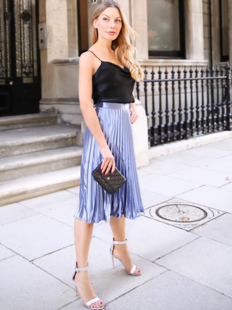 A fitted knee-lenght pencil skirt is considered the right mix of feminine and flirty. Picture: Instagram/Anna Bey