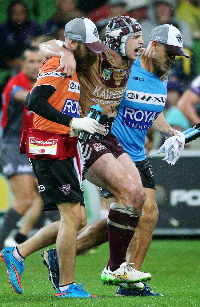 Jamie Buhrer leaves the ground with a knee injury in the Round 8 clash against the Storm last year. Picture: Colleen Petch.