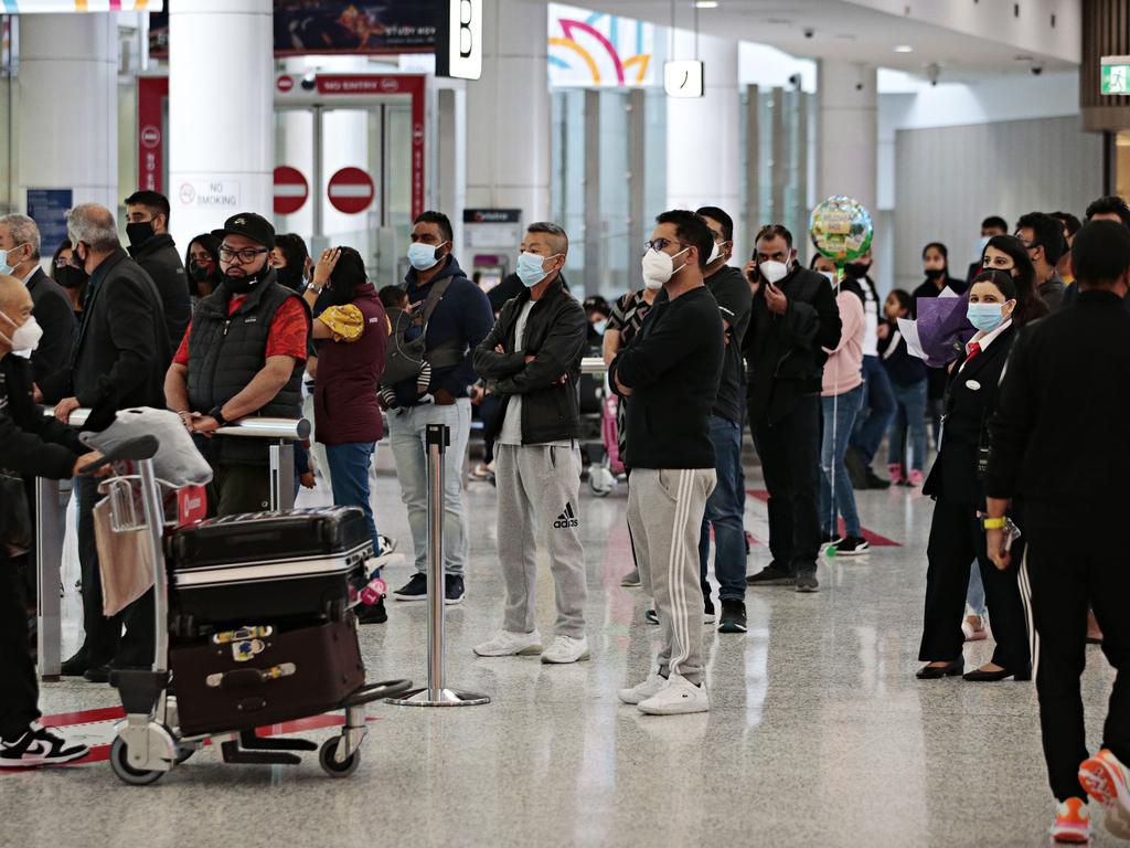 Families reuniting at Sydney International Airport after being separated due to Covid-19 border closures. Picture: Adam Yip