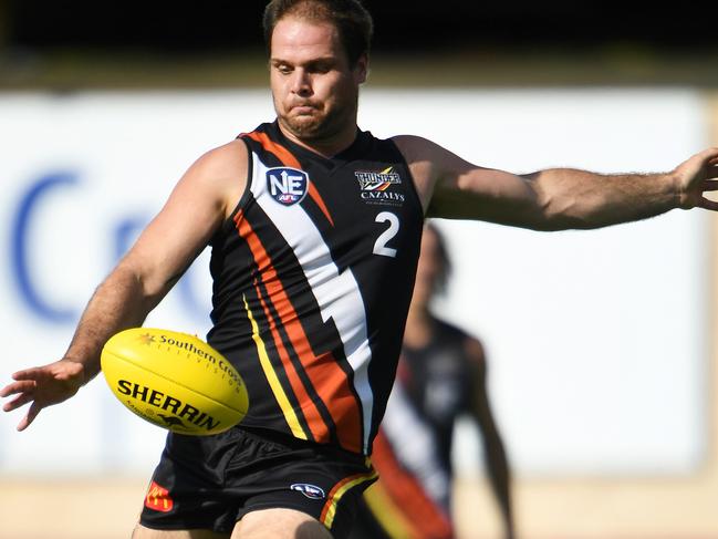 NT Thunder's  Darren Ewing kicks for a goal during Saturday's game against the Redland Bombers at TIO Oval in Darwin.Picture: Justin Kennedy