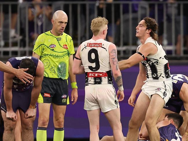 PERTH, AUSTRALIA - MAY 24: Players react after the final siren during the round 11 AFL match between Walyalup (the Fremantle Dockers) and Collingwood Magpies at Optus Stadium, on May 24, 2024, in Perth, Australia. (Photo by Paul Kane/Getty Images)