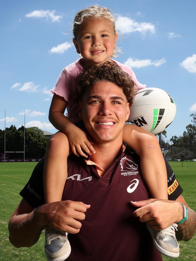 Reece Walsh with daughter Leila after signing his extended contract with the Brisbane Broncos. Picture: Liam Kidston