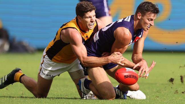 Hawk Luke Breust lays a tackle on Docker Ethan Hughes. Picture: Paul Kane/Getty Images