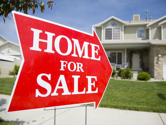 Leader Newspapers real estate Hot Topic - things to do before you sell - for editions week commencing June 12, 2017 -  Peter Koulizos - iStock-157198401 An arrow shaped red "Home For Sale" sign in front of a suburban 2-story home.  The green grass and blue sky is visible in the background.