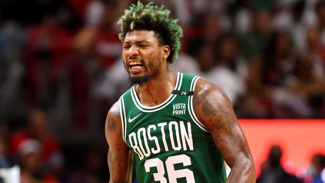 MIAMI, FLORIDA - MAY 19: Marcus Smart #36 of the Boston Celtics reacts after a three point basket during the fourth quarter against the Miami Heat in Game Two of the 2022 NBA Playoffs Eastern Conference Finals at FTX Arena on May 19, 2022 in Miami, Florida. NOTE TO USER: User expressly acknowledges and agrees that, by downloading and or using this photograph, User is consenting to the terms and conditions of the Getty Images License Agreement.   Michael Reaves/Getty Images/AFP == FOR NEWSPAPERS, INTERNET, TELCOS & TELEVISION USE ONLY ==