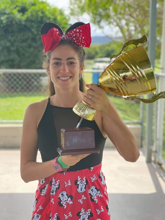 Wanderers' Evelien Rosier with the broken FNQ Rugby Women's trophy during the club’s celebrations. Picture: Facebook