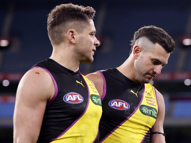 MELBOURNE, AUSTRALIA - JULY 14:  Dion Prestia and Jack Graham of the Tigers walks from the ground after  the round 18 AFL match between Richmond Tigers and Greater Western Sydney Giants at Melbourne Cricket Ground, on July 14, 2024, in Melbourne, Australia. (Photo by Darrian Traynor/AFL Photos/via Getty Images)