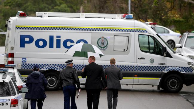 A police van parked outside the murder house. Picture: Jonathan Ng