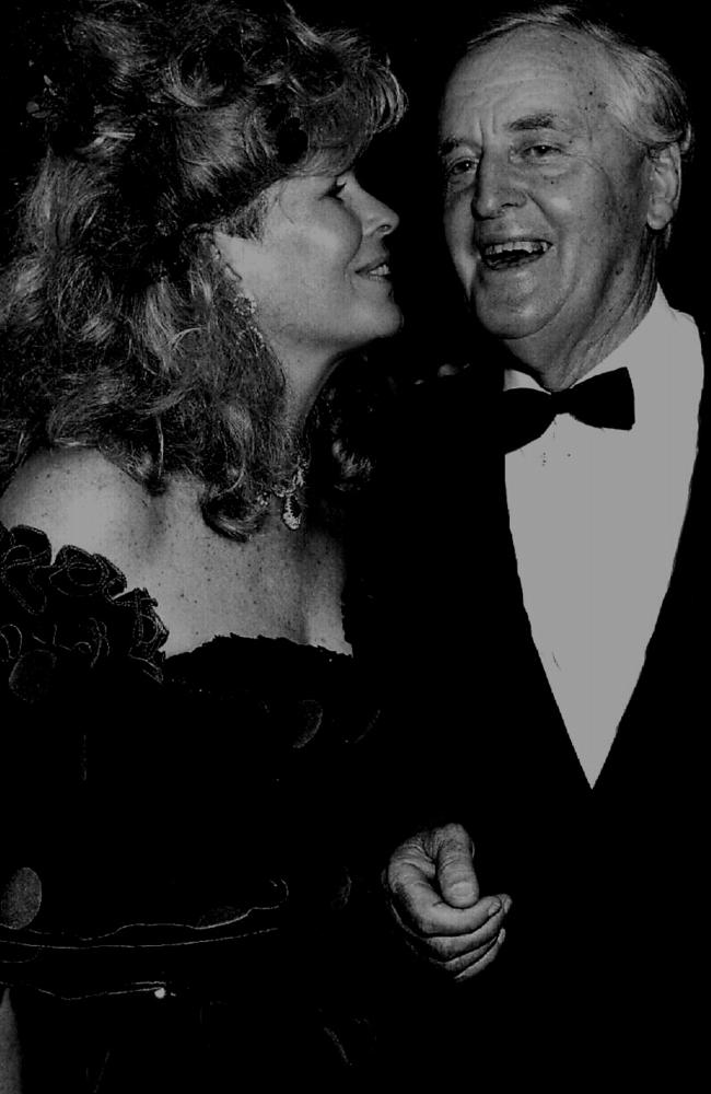 Wife of businessman Christopher Skase, Pixie with former Queensland Premier Sir Joh Bjelke-Petersen at Qintex Christmas/new year party in 1985. Photo: Courier Mail photo archives