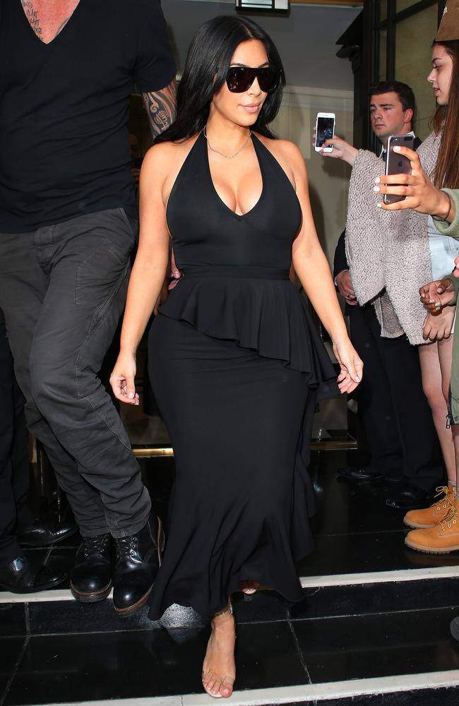 Kim Kardashian West flashing ample cleavage out and about in London on June 26, 2015. Picture: Splash