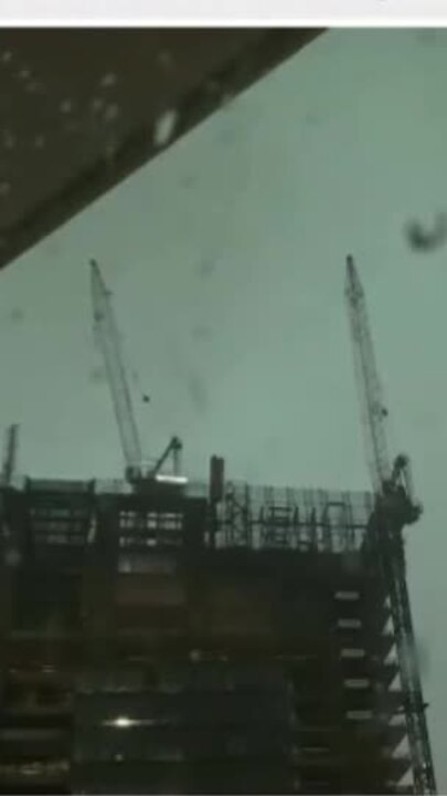 Crane rocked by wild Brisbane storms