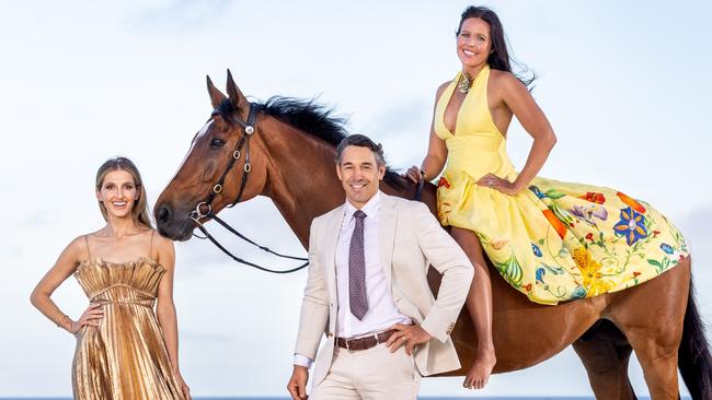 Kate Waterhouse with Billy and Nicole Slater (astride horse Bruce), enjoying the sea air ahead of the Magic Millions carnival next January. Picture: Luke Marsden.