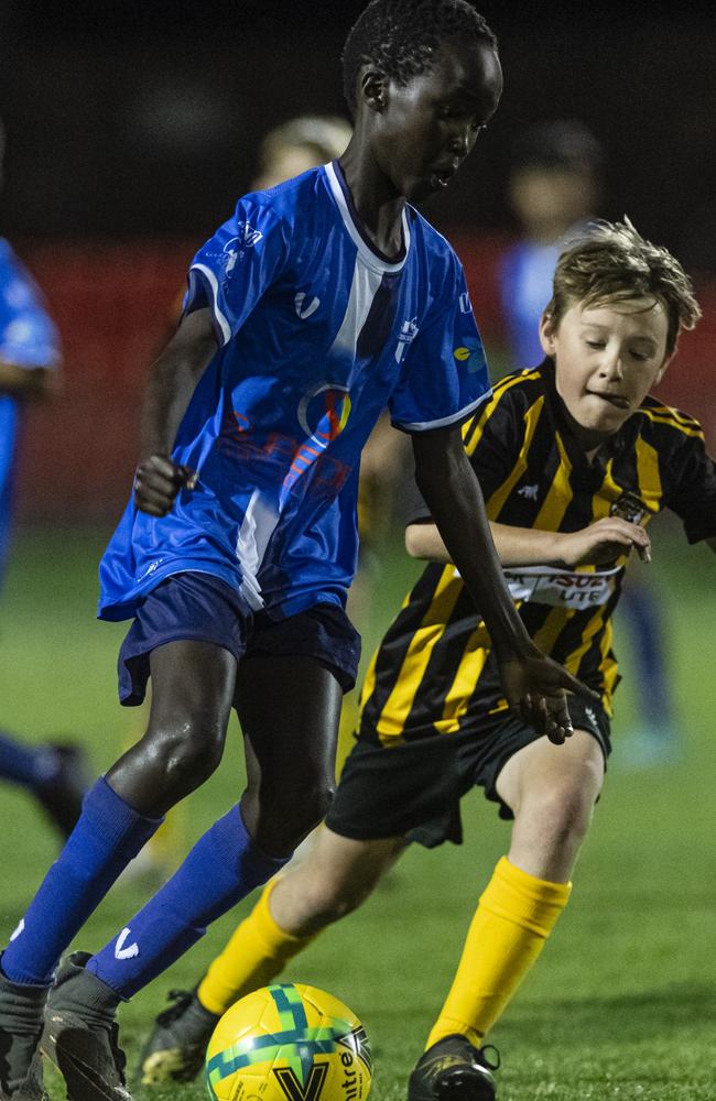 Peter Ajak (left) of Rockville Rovers Blue and Jack Cuskelly of Football Dalby in Football Queensland Darling Downs Community Juniors U13 Div 1 White grand final at Clive Berghofer Stadium, Friday, August 30, 2024. Picture: Kevin Farmer