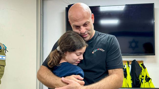 Israeli former hostage Hila Rotem-Shoshani (13) embraces her uncle at a hospital in Israel. Picture: Israel Army / AFP