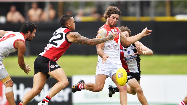 Jydon Neagle under pressure while playing in the Northern Territory Football League.