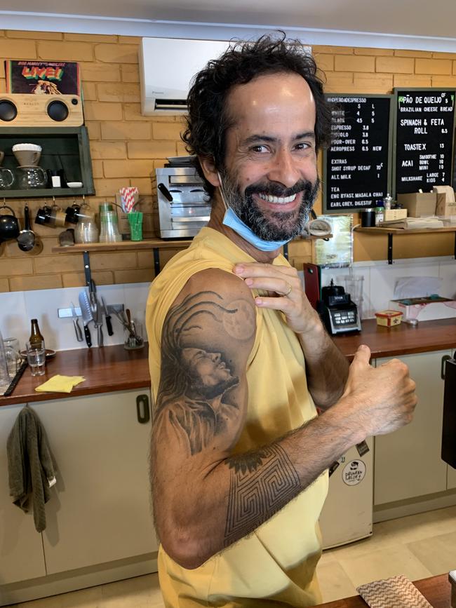 Matheus “Matta” Ponciano Maricel’s Bob Marley tattoo is a symbol for the laid-back vibe of the cafe. Picture: Matt Gazy