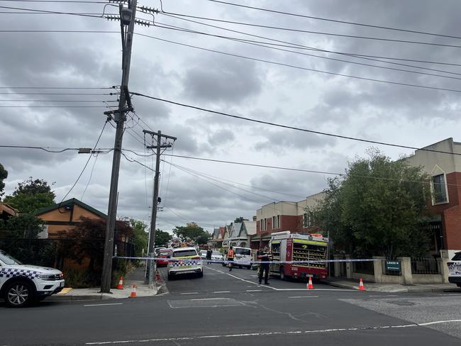 Police have cordoned off Walker St in Coburg after a house went up in flames