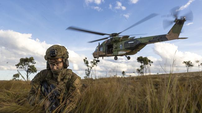 Soldiers from the 4th Regiment, Royal Australian Artillery dismount from an MRH-90 Taipan during Exercise Chau Pha in Townsville. PIcture: Department of Defence