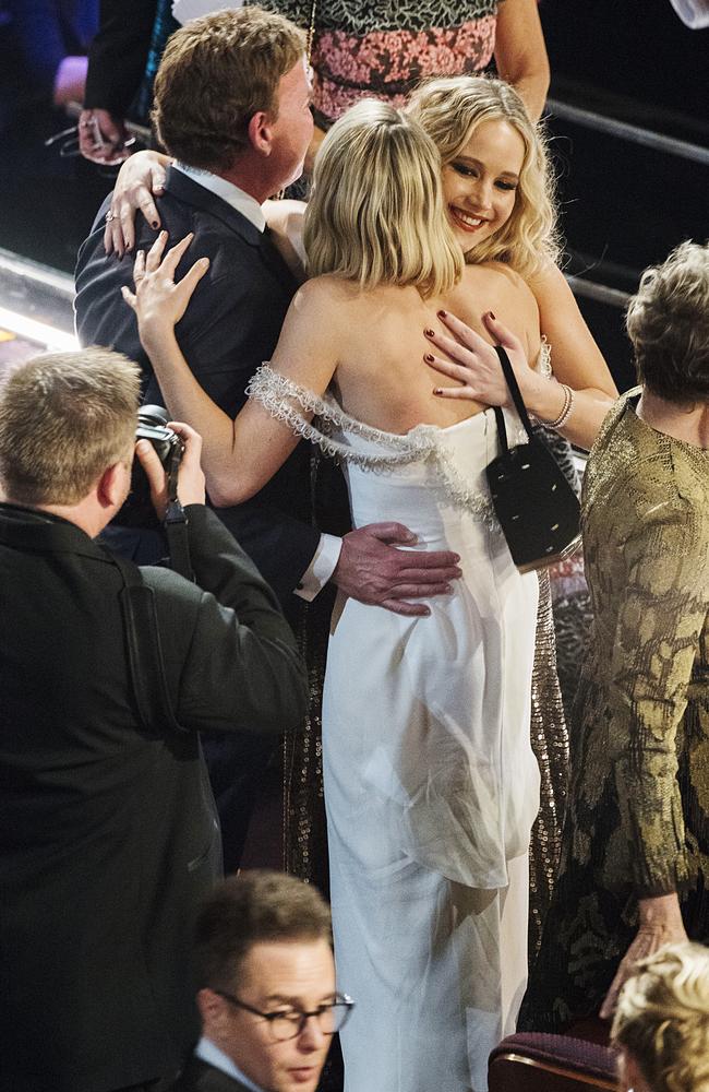 Jennifer Lawrence and Margot Robbie hug in the audience during the 90th Annual Academy Awards at the Dolby Theatre on March 4, 2018 in Hollywood, California. Picture: Getty