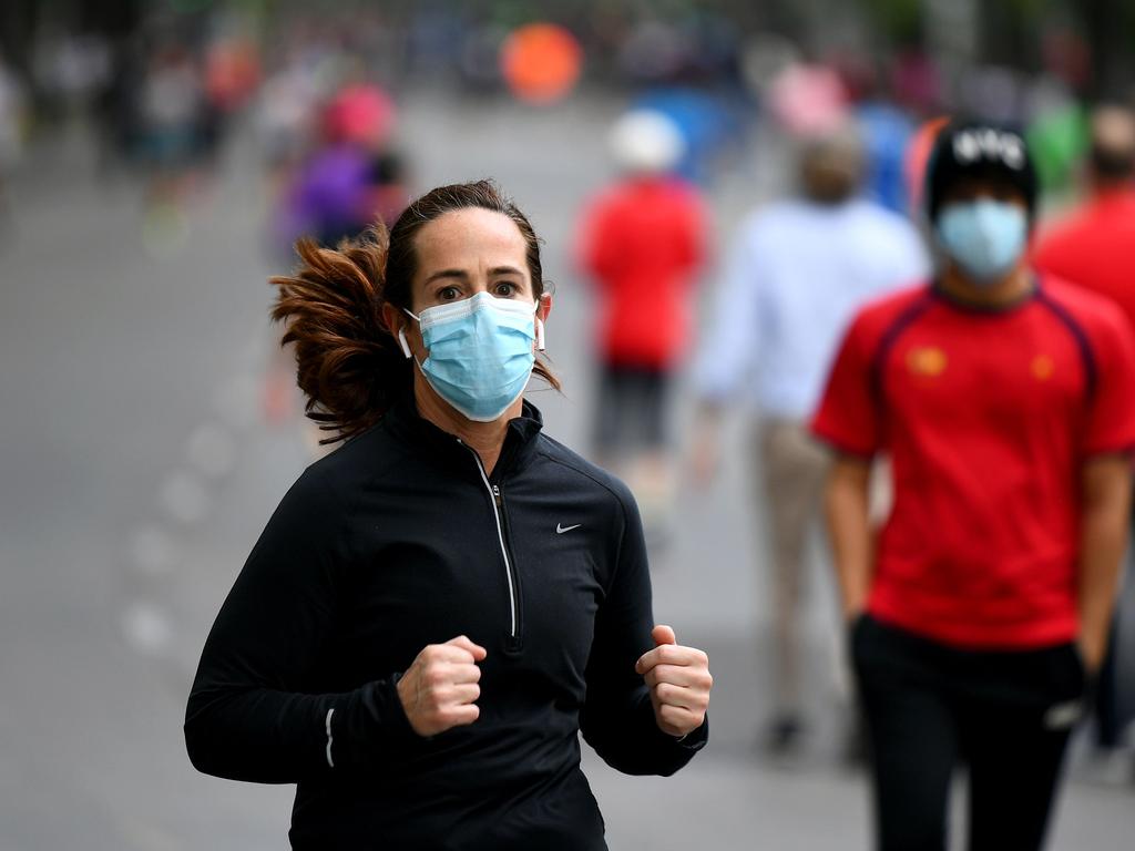 People exercise wearing masks in Madrid. Picture: AFP