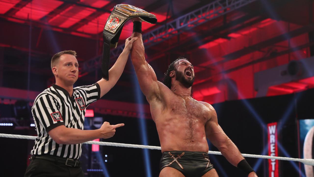 Drew McIntyre celebrates winning the WWE Championship from Brock Lesnar at WrestleMania 36.