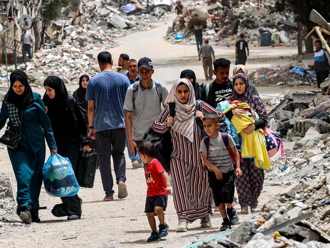 Displaced Palestinians evacuate from the Tal al-Zaatar camp for Palestinian refugees in the northern Gaza Strip on May 11. Picture: AFP