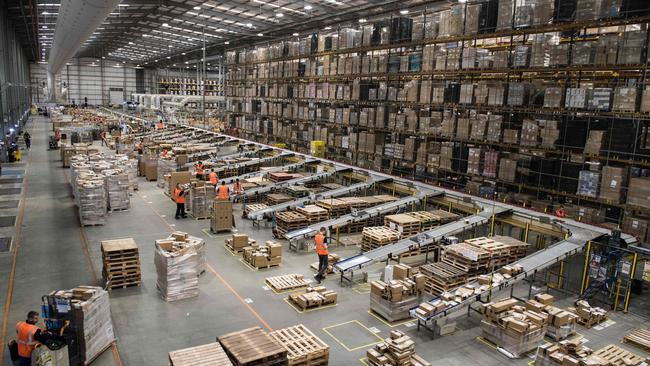 Amazon workers prepare customer orders for dispatch. Picture: AFP