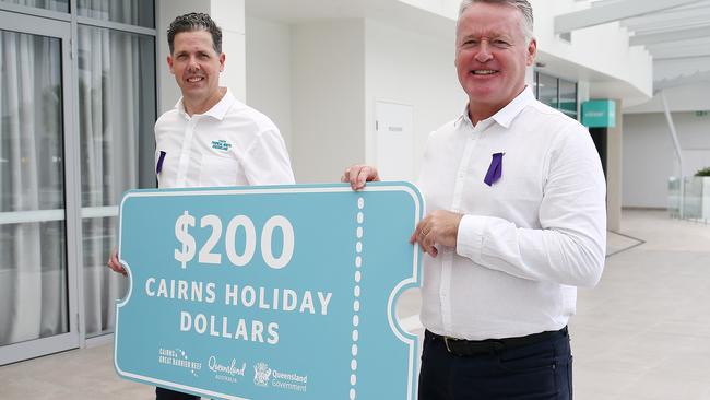 TTNQ CEO Mark Olsen and Member for Cairns Michael Healy. Mr Healy said the new grants were about ensuring high-volume tour operators remained afloat. Picture: Brendan Radke