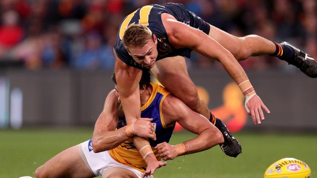 Daniel Talia flies over Josh Kennedy. Picture: James Elsby/AFL Photos/Getty Images