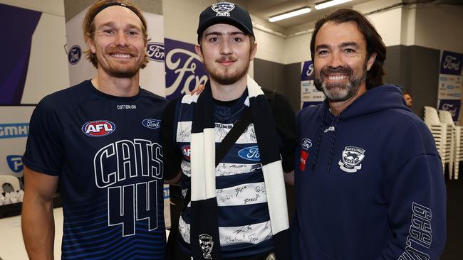 Angus with Cats coach Chris Scott and Stewart before the game. Picture: Michael Klein