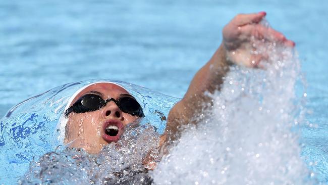 Canada's Kylie Masse on her way to a new Commonwealth Games record in the women’s 100m backstroke heats. Photo: AP