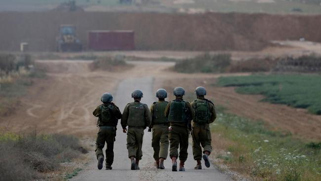 Israeli soldiers near the Kfar Aza kibbutz MENAHEM KAHANA/AFP/GETTY IMAGES